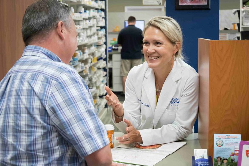 Pharmacist assisting a customer at Concord Medicine Shoppe
